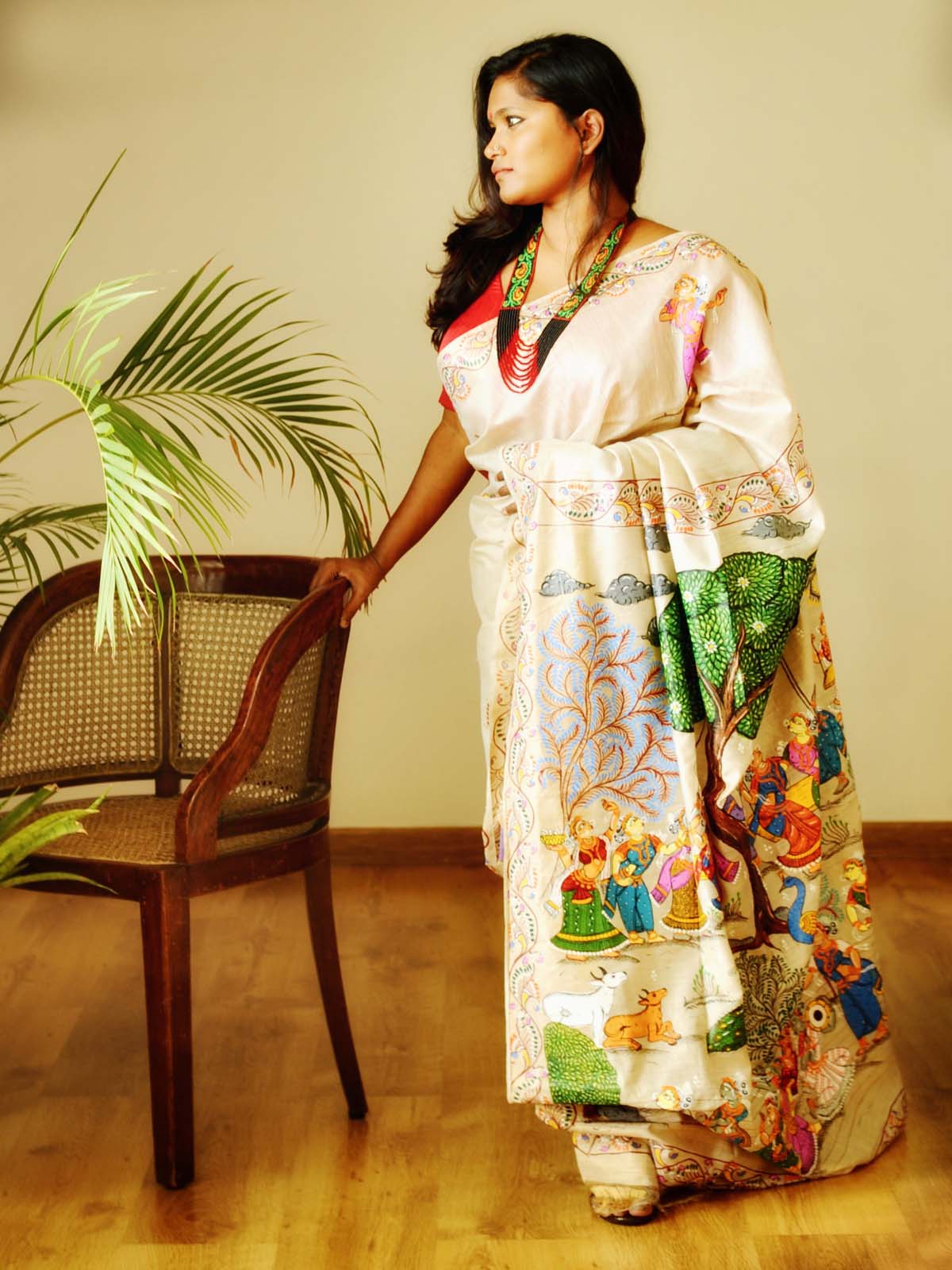 "At Brindavan" - Beige-Gold Handpainted Pattachitra Saree