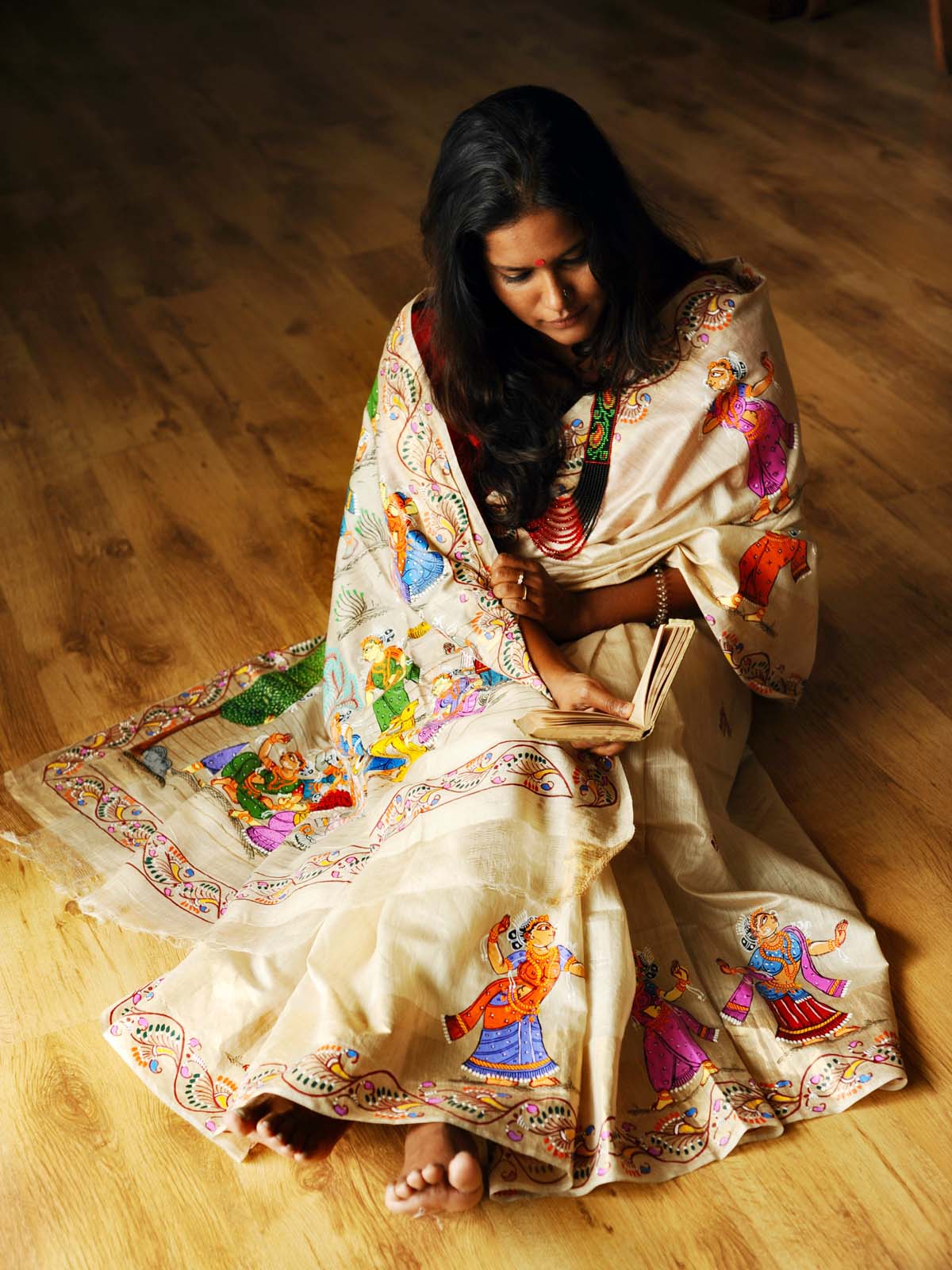 "At Brindavan" - Beige-Gold Handpainted Pattachitra Saree