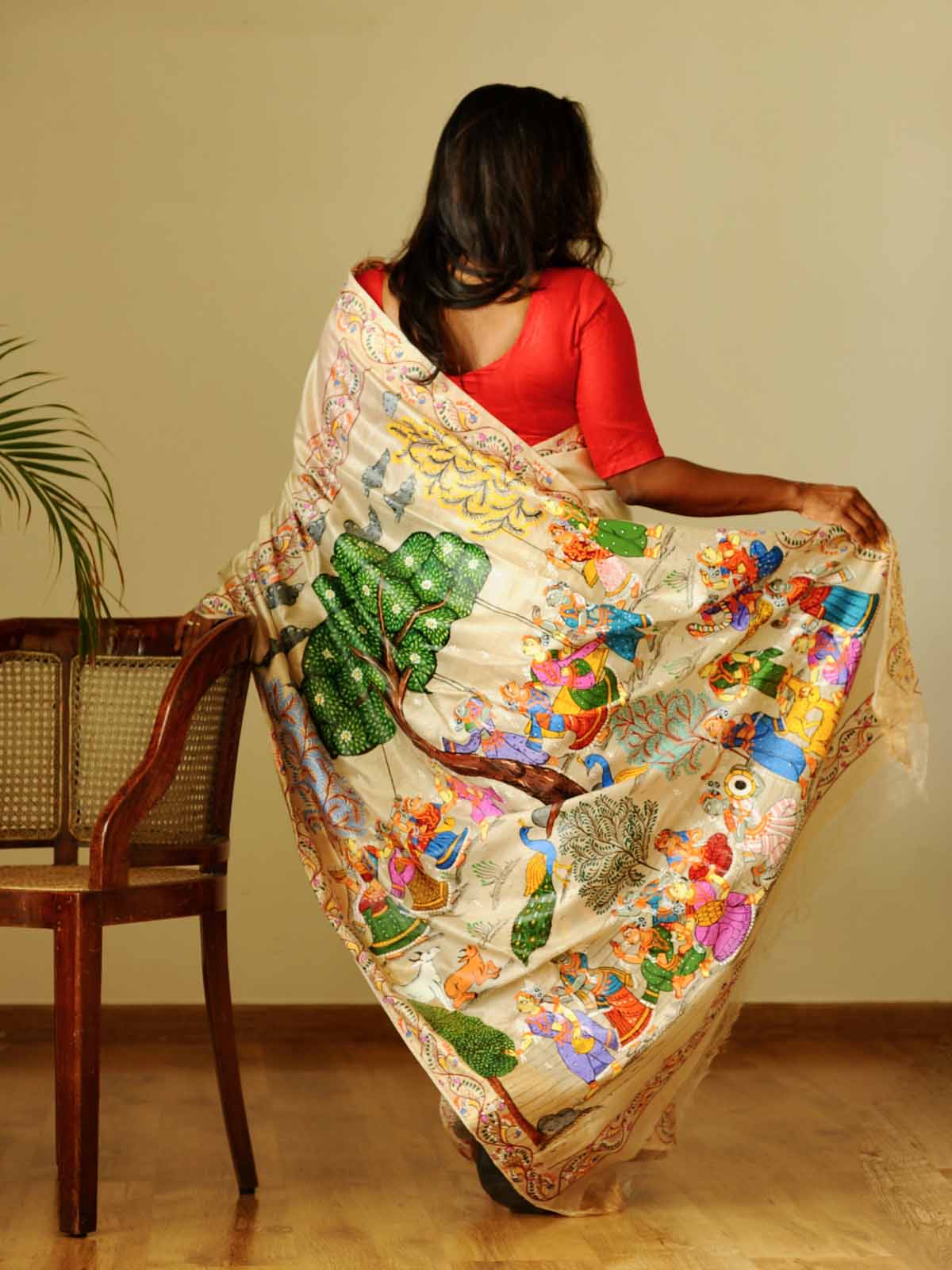 "At Brindavan" - Beige-Gold Handpainted Pattachitra Saree